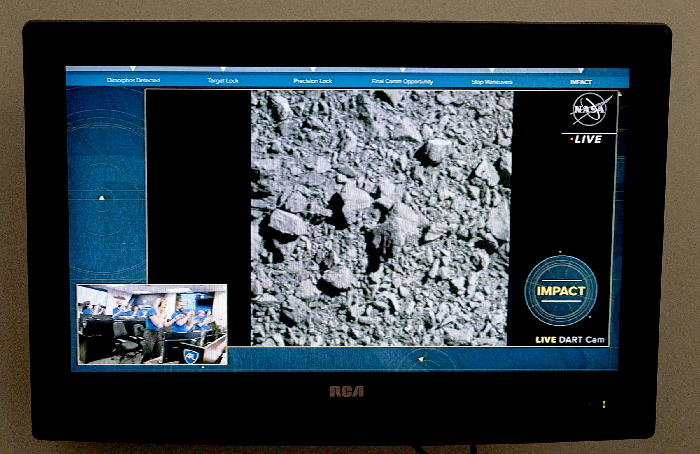 A television at NASA's Kennedy Space Center in Cape Canaveral, Florida, captures the final images from the Double Asteroid Redirection Test (DART) as it smashes into the asteroid Dimorphos on September 26, 2022. - NASA's DART spaceship on September 26 struck the moonlet asteroid Dimorphos, in a historic test of humanity's ability to prevent a cosmic object devastating life on Earth. (Photo by Jim WATSON / AFP)