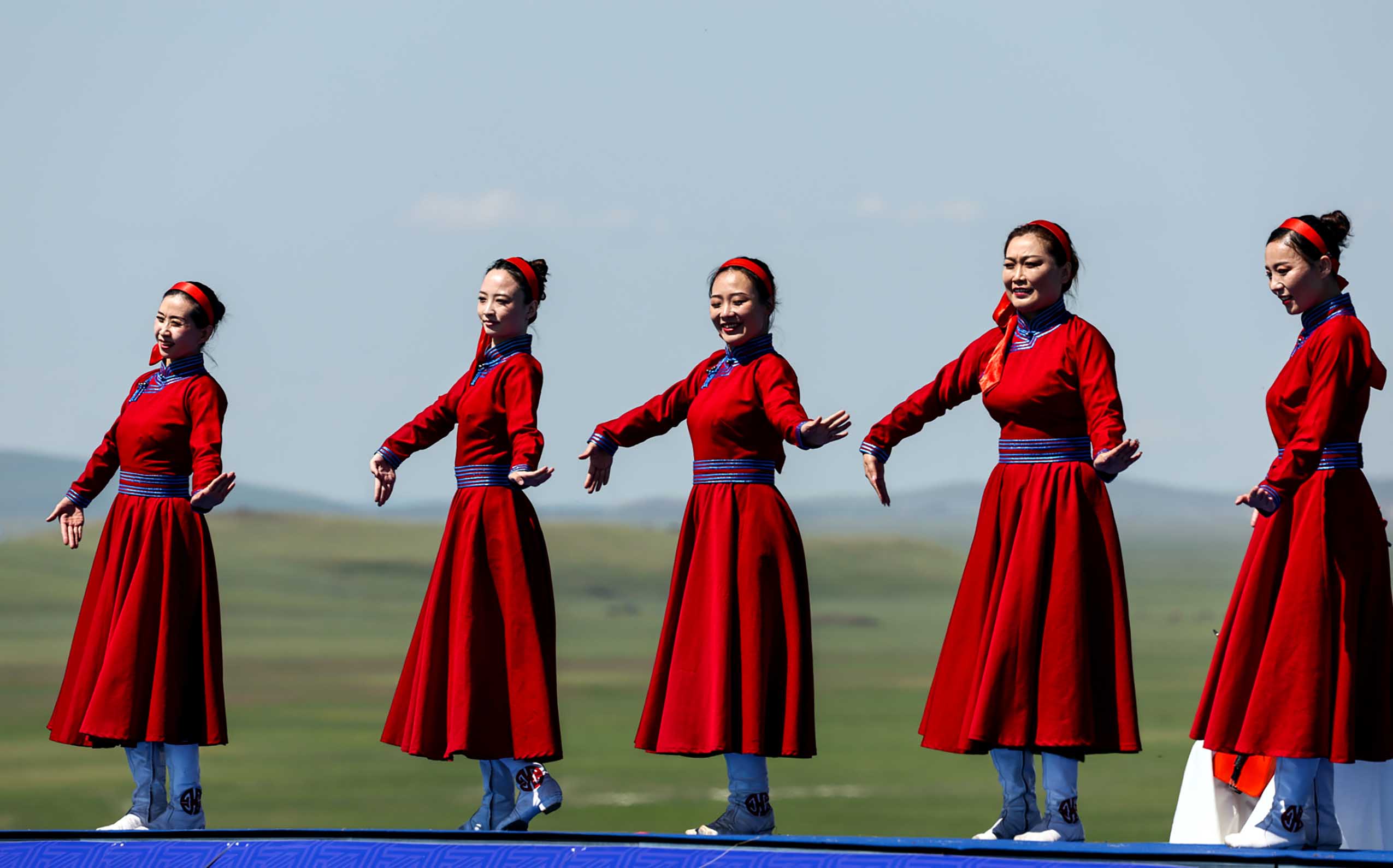 Actors perform during the second edition of the Hulun Buir grassland culture and tourism festival in Hulun Buir, north China's Inner Mongolia Autonomous Region, July 1, 2023. The second edition of the Hulun Buir grassland culture and tourism festival kicked off here on Saturday, attracting nationwide tourists with various performances of folk culture. (Xinhua/Lan Hongguang)